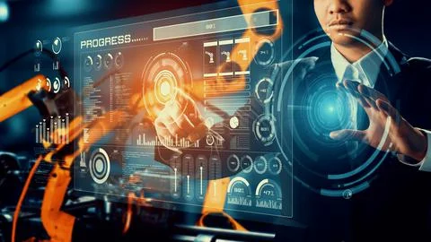 Engineer use cybernated robotic software control industry robot arm in factory Stock Photos