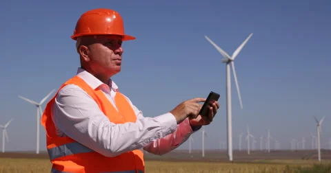 Engineer Use Tablet Planning Future Location Wind Turbine Best Spin Rotation Stock Footage 58773825