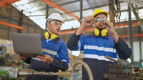 Engineer use vernier caliper to measure diameter of metal Stock Footage 184514823