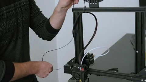 An engineer uses a 3D printer for 3D printing in the lab. Stock Footage 146127173