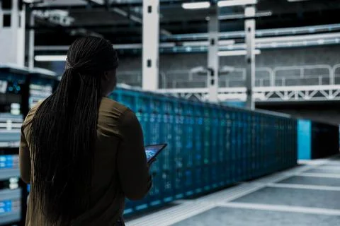 Engineer uses AI assistant to implement security measures in data center 库存照片