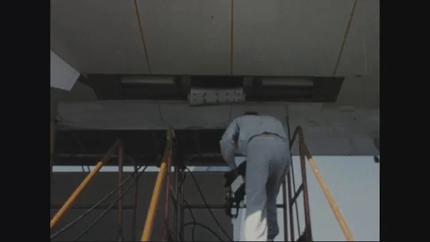 Engineer uses a device to test for fumes in the fuel cell cavity - 1957 Stock Footage 101160667