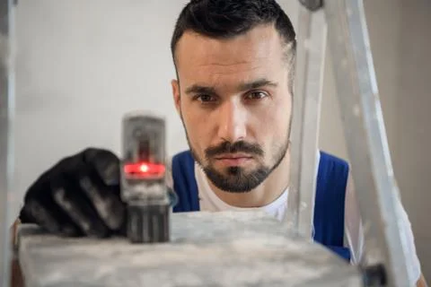 The engineer uses an electronic ruler, close-up Stock Photos