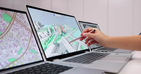 Engineer Uses GIS Software To Inspect Construction Project On PC. Fotos de archivo