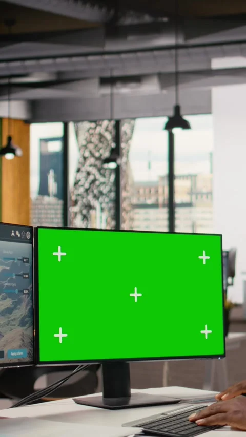 Engineer uses green screen mockup PC to do clean energy production testing Stock Footage 315417016