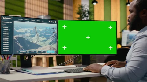 Engineer uses green screen mockup PC to do clean energy production testing Stock Footage 315614218