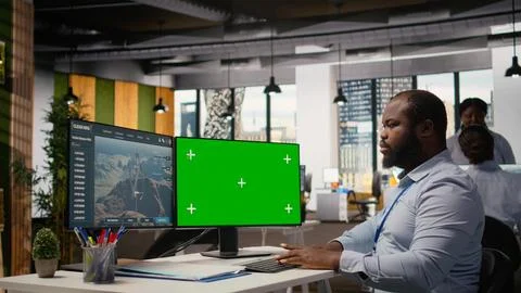 Engineer uses green screen mockup PC to do clean energy production testing Stock Photos