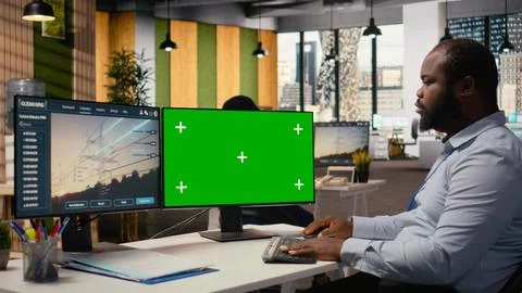 Engineer uses isolated screen computer to develop smart electric grid Stock Photos