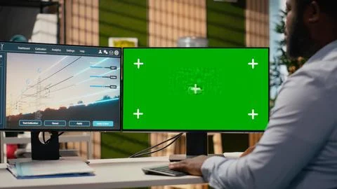 Engineer uses isolated screen computer to develop smart electric grid Stock Photos
