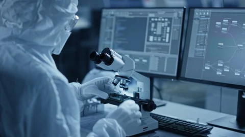 Engineer Uses Microscope to Inspect Samples, Developing Modern High Tech Stock Footage 126151816