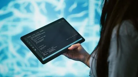 Engineer uses tablet and AI deep neural networks to solve tasks Foto stock