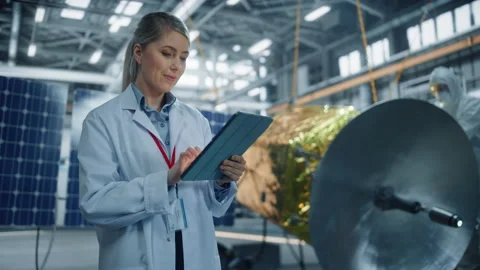 Engineer Uses Tablet Develop Satellite Stock Footage 150132553
