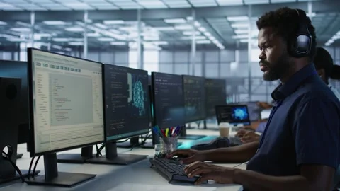 Engineer using audio device to hear podcasts in data center Stock Footage 319572786