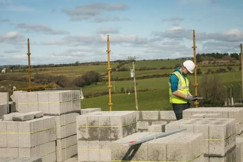 Engineer using digital tablet at the construction site Stock Photos