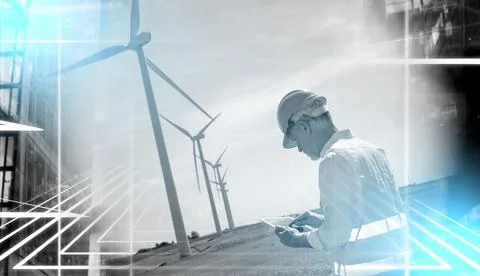 Engineer using digital tablet for wind turbine inspection; light effect Stock Photos