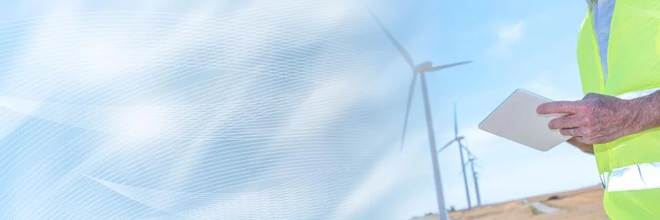 Engineer using digital tablet for wind turbine inspection; panoramic banner Stock Photos