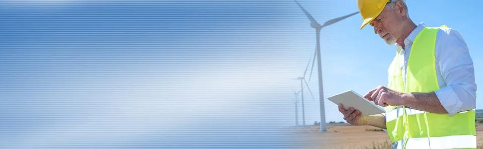 Engineer using digital tablet for wind turbine inspection; panoramic banner 写真素材