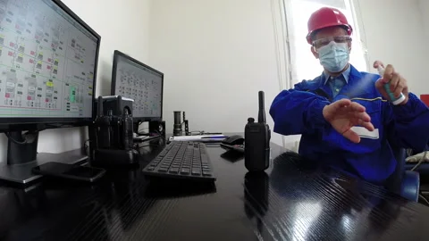 Engineer Using Hand Disinfectant Spray to Against Coronavirus Stock Footage 169365717
