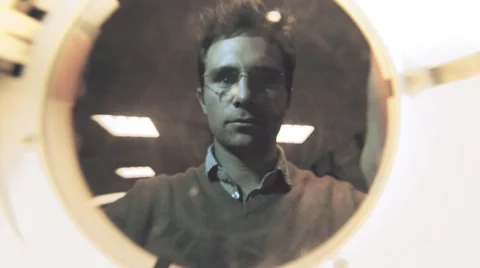 Engineer using illuminated magnifying glass Stock Footage 53039026