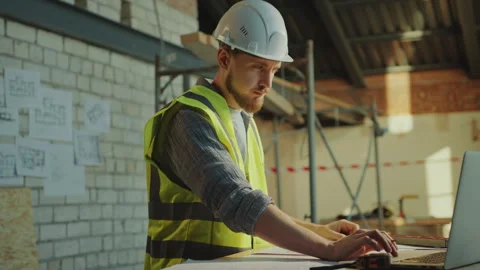 Engineer Using Laptop and Drawing Architectural Plan at Construction Site Vídeos de archivo 273482892