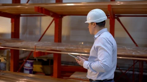 Engineer using laptop computer, employee male warehouse worker engineer in hard Stock Footage 102742483