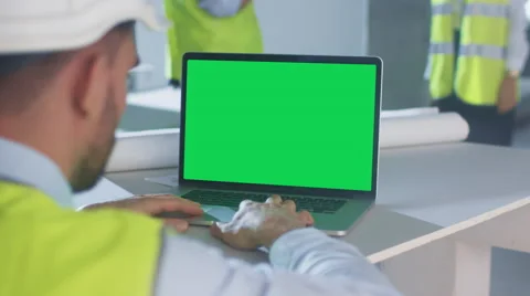 Engineer using Laptop Computer with Green Screen on Construction. Stock Footage 67543951