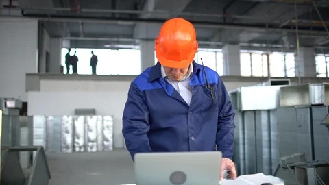 Engineer is Using Laptop in Industrial Environment. slow-motion Stock Footage 85871539