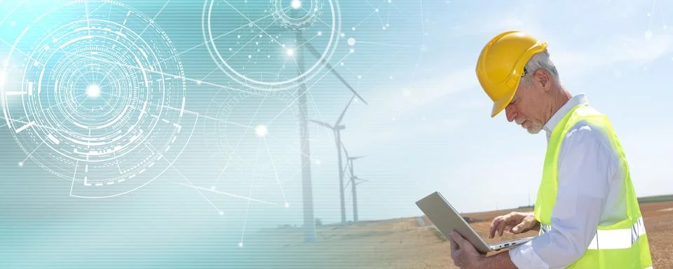 Engineer using laptop for wind turbine inspection; panoramic banner Stock Photos