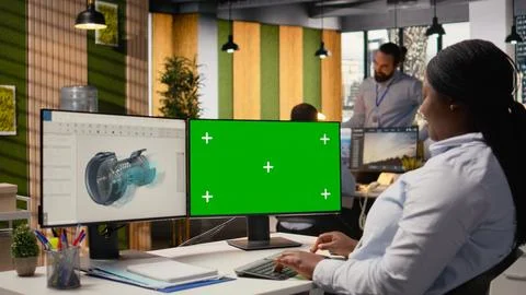 Engineer using mockup computer to reduce carbon footprint of wind turbines Foto stock