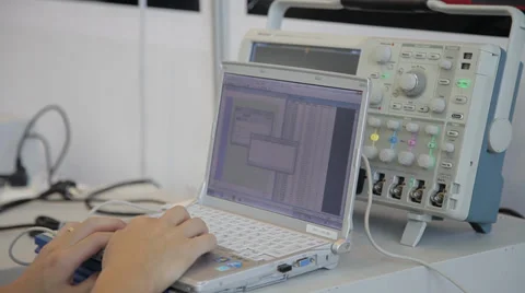 Engineer using a notebook PC with instrument Vídeo Stock 38013866