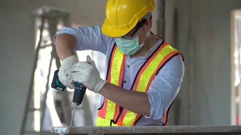 Engineer using power drill in construction site Stock Footage 146445267