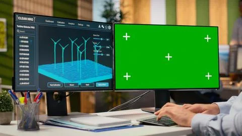 Engineer using software on mockup PC used for planning wind farm layouts Stock Photos