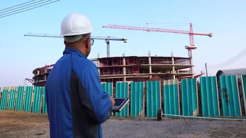 Engineer Using Tablet Computer on Construction Site Stock Footage 147605656