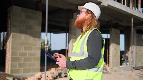 Engineer using tablet  at construction site writes notes about poor quality Stock Footage 274479513