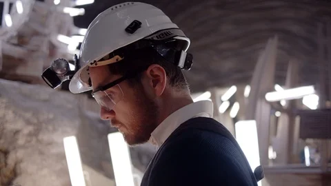 Engineer using tablet gadget in futuristic construction site. Slow motion sho Video stock 107254685