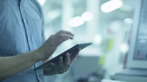 Engineer is Using Tablet PC in Factory Stock Footage 45137766