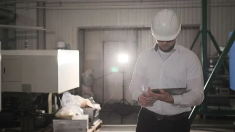 Engineer Is Using Tablet Pc In Factory. Slow-Motion. Stock Footage 114502626
