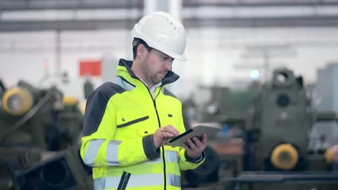 Engineer Is Using Tablet Pc In Factory. Slow-Motion. Stock Footage 171775491