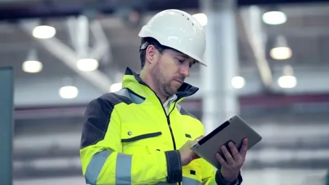 Engineer Is Using Tablet Pc In Factory. Slow-Motion. Stock Footage 171775494