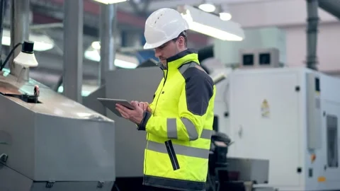 Engineer Is Using Tablet Pc In Factory. Slow-Motion. Stock Footage 171775508