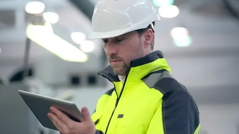 Engineer Is Using Tablet Pc In Factory. Slow-Motion. Stock Footage 171775520