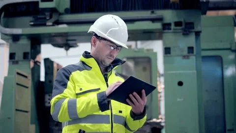 Engineer Is Using Tablet Pc In Factory. Slow-Motion. Stock Footage 171953147