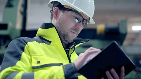 Engineer Is Using Tablet Pc In Factory. Slow-Motion. Stock Footage 171953267