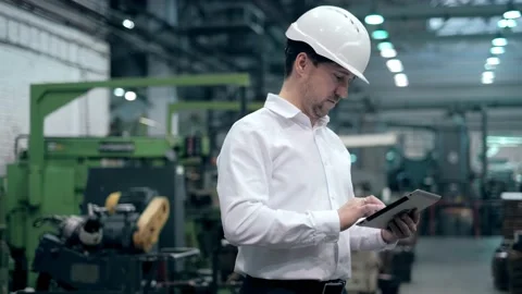 Engineer Is Using Tablet Pc In Factory. Slow-Motion. Stock Footage 171953324