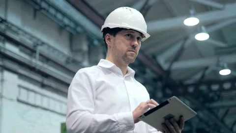 Engineer Is Using Tablet Pc In Factory. Slow-Motion. Stock Footage 172014462