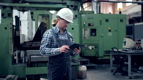 Engineer Is Using Tablet Pc In Factory. Slow-Motion. Stock Footage 172016558