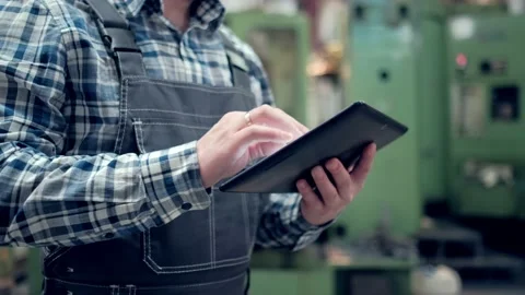 Engineer Is Using Tablet Pc In Factory. Slow-Motion. Stock Footage 172016610