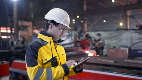 Engineer Is Using Tablet Pc In Factory. Slow-Motion. Stock Footage 237554298