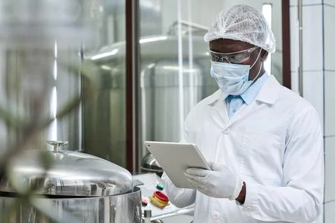 Engineer using tablet pc at factory Stock Photos