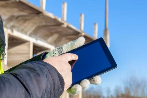 Engineer using tablet PC near unfinished bridge Stock Photos